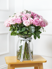 50 Pink Roses in a vase – A bouquet as extraordinary as they are! Surprise someone special with 50 Long-Stem Pink...