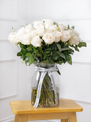 50 White roses in a vase – A timeless statement of love and grace. Gift 50 Long-Stem White Roses to celebrate...