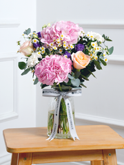 Sweet Pastel Vase – Brighten up any space with our 'Sweet Pastel' arrangement, featuring soft pink hydrangeas, peach...
