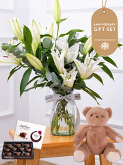 Anniversary White Lily - Vase Gift Set – The White Lily in a vase adorned with eucalyptus and pistach leaves serves as...