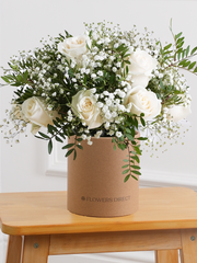 White Roses Hatbox – Celebrate any special occasion with our stunning 12 white roses hatbox, elegantly complemented by gypsophillia and...