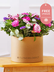 Purple Majesty Hatbox Free Upgrade – Experience the regal and majestic beauty of our "Purple Majesty" arrangement, featuring luxurious deep...