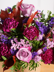 Autumn Purple Majesty Hatbox – Experience autumn's beauty with our Autumn Purple Majesty arrangement, featuring purple roses, purple carnations, thistles,...