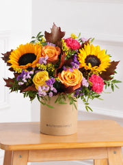 Autumn Charm Hatbox – Embrace the season with our Autumn Charm hatbox, featuring yellow and orange roses, cerise...