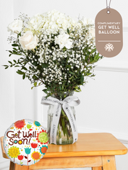 Pure Bliss - Vase with Free Get Well Balloon – Indulge in the pure and serene beauty of our "Pure Bliss" arrangement, featuring pristine...