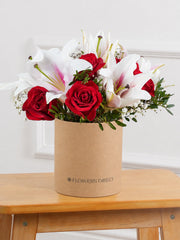 Red Roses and Pink Lily - Hatbox –  Our Red Roses and Pink Lily Hatbox is a stunning combination of passion and...