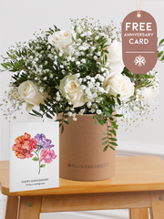 White Roses Hatbox with Free Happy Anniversary Card –  Celebrate any special occasion with our stunning 12 white roses hatbox, elegantly complemented by gypsophillia and...