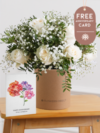 White Roses Hatbox with Free Happy Anniversary Card –  Celebrate any special occasion with our stunning 12 white roses hatbox, elegantly complemented by gypsophillia and...