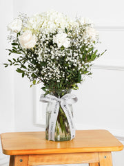 Pure Bliss Vase – Indulge in the pure and serene beauty of our "Pure Bliss" arrangement, featuring pristine...