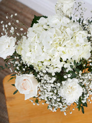 Pure Bliss Vase – Indulge in the pure and serene beauty of our "Pure Bliss" arrangement, featuring pristine...